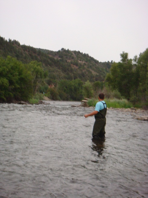 Fly fishing off the river bed