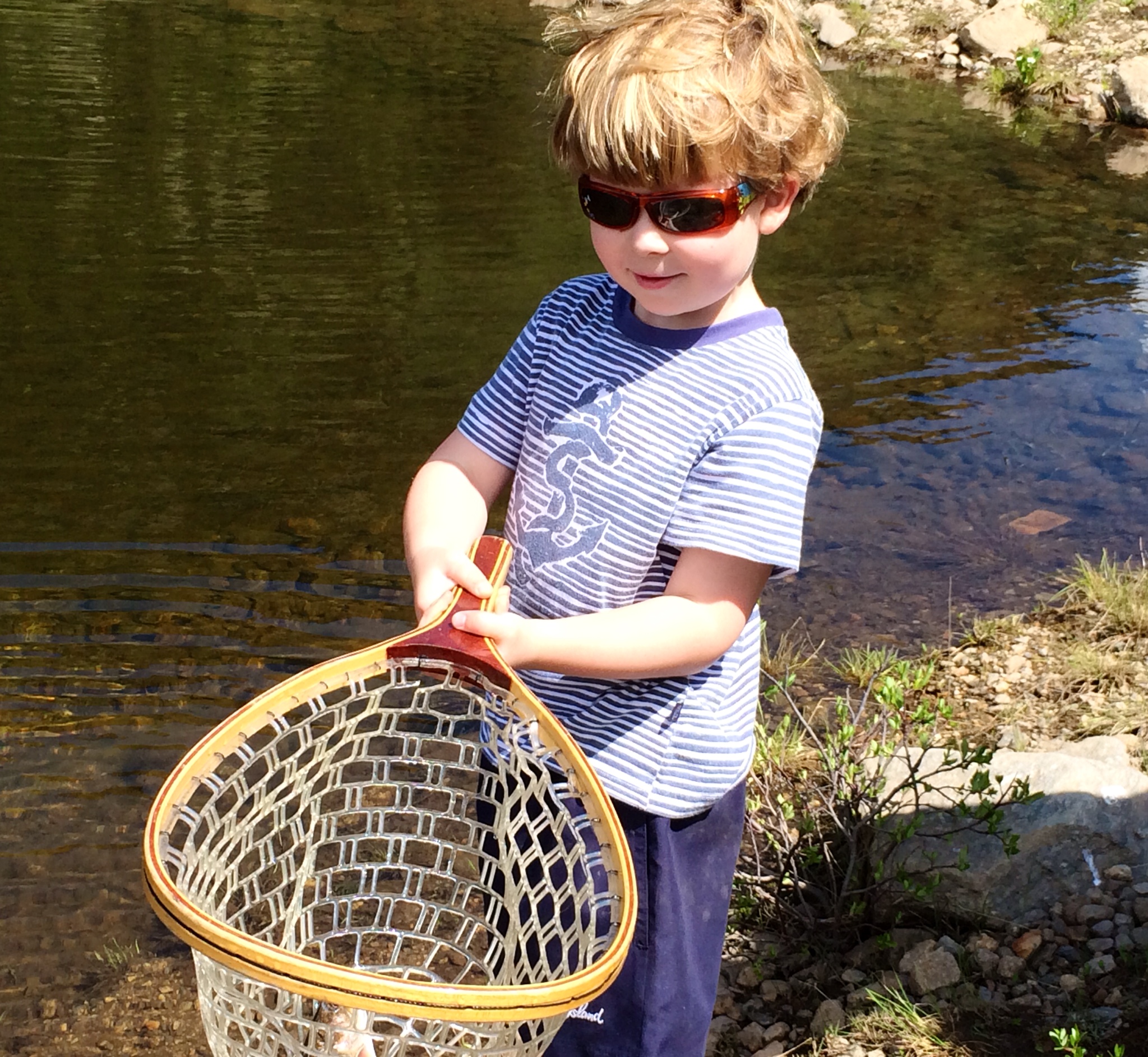 smallwood boy fishing with net