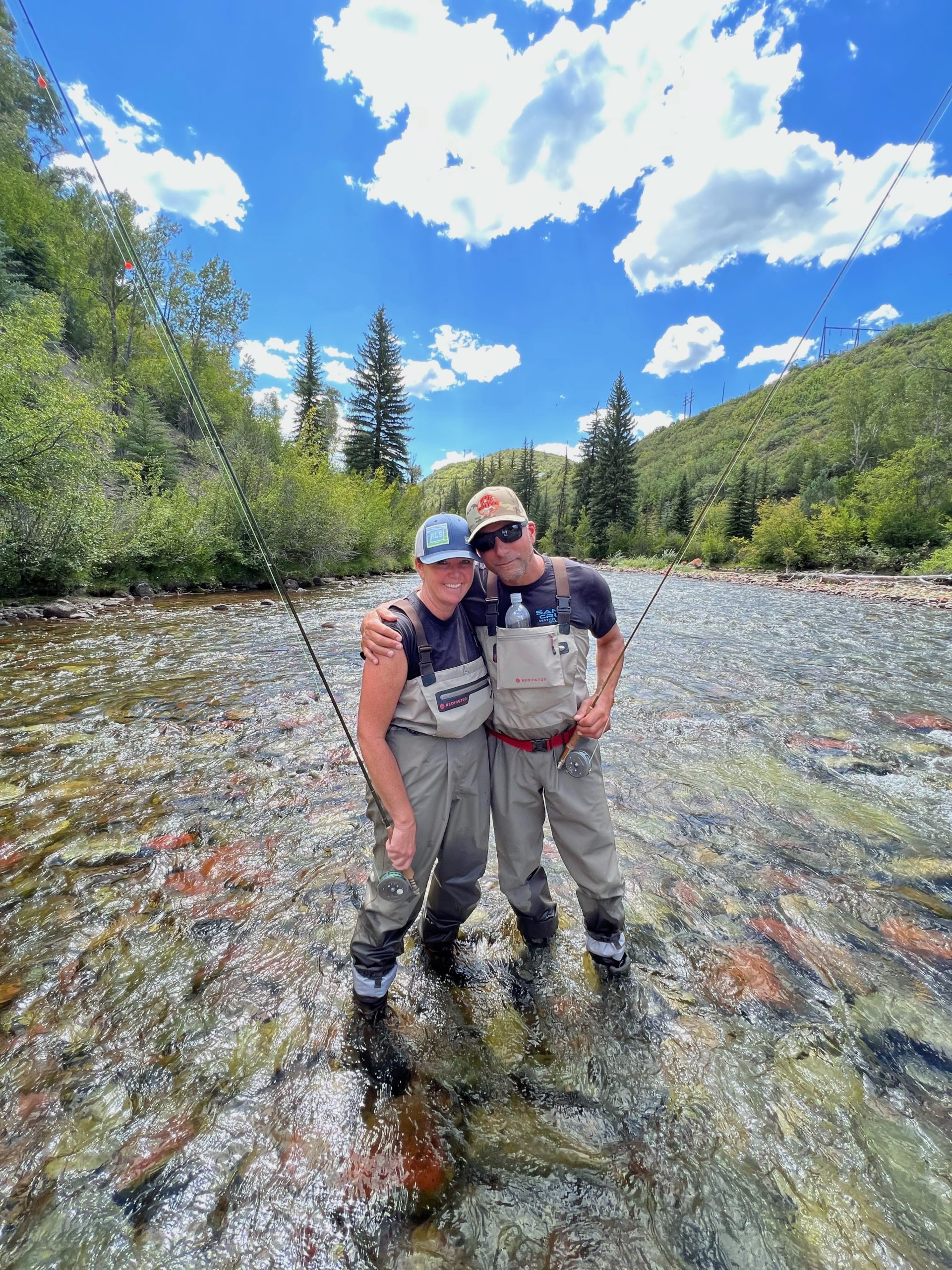 Young couple fishing for trout in the Roaring Fork River